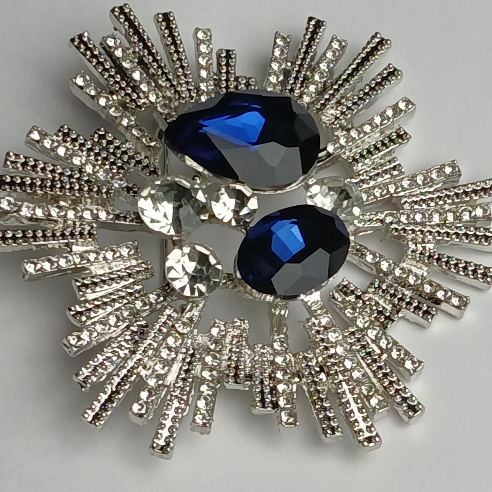 Crystal Sunburst Brooch with Deep Blue Stones
